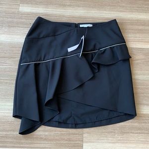 Chelsea &Walker asymmetrical bottom blk mini skirt